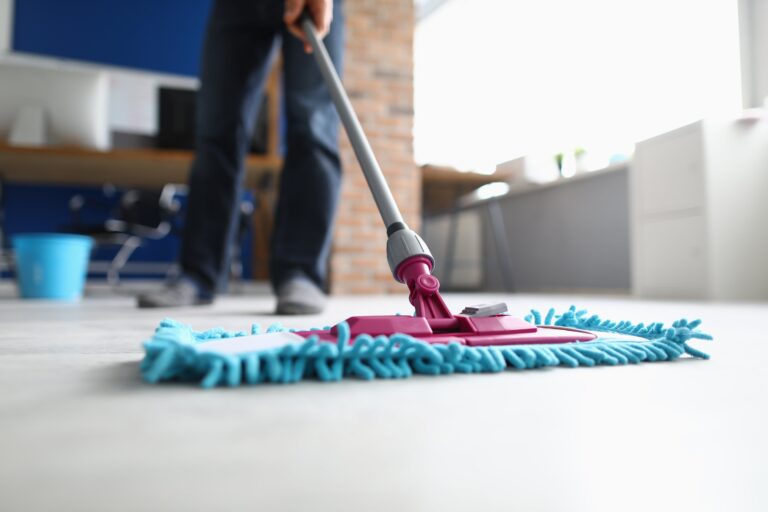 man with mop washes floor office cleaning company services concept 2 768x512 1